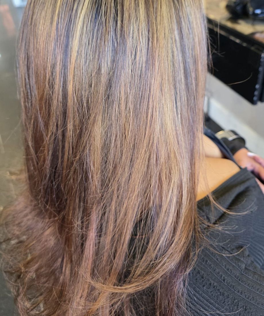 Blonde highlights and layered styling by Hair Perfect hairdressers in Fulham