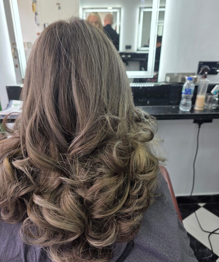 Bouncy ladies blow dry with soft curls at Hair Perfect salon in Fulham